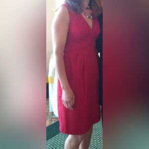 A timeless red dress that is fully lined.